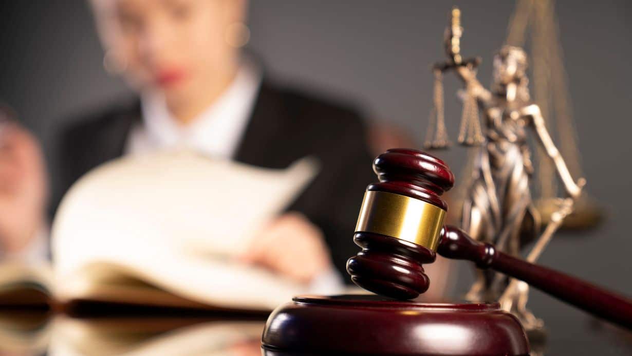 The number of ADA lawsuits is on the increase. Young female lawyer at her desk.