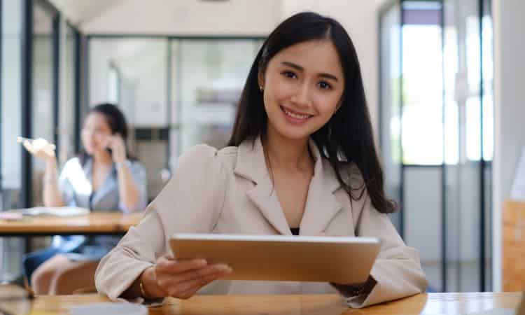 A woman holding an ipad