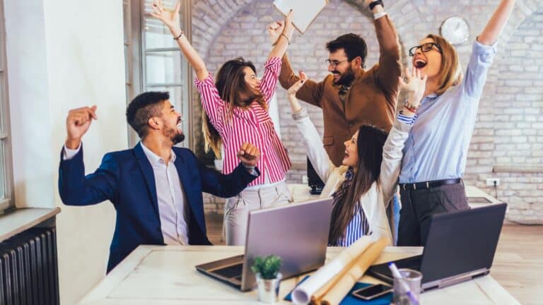 A group of business team mates celebrating their achievement