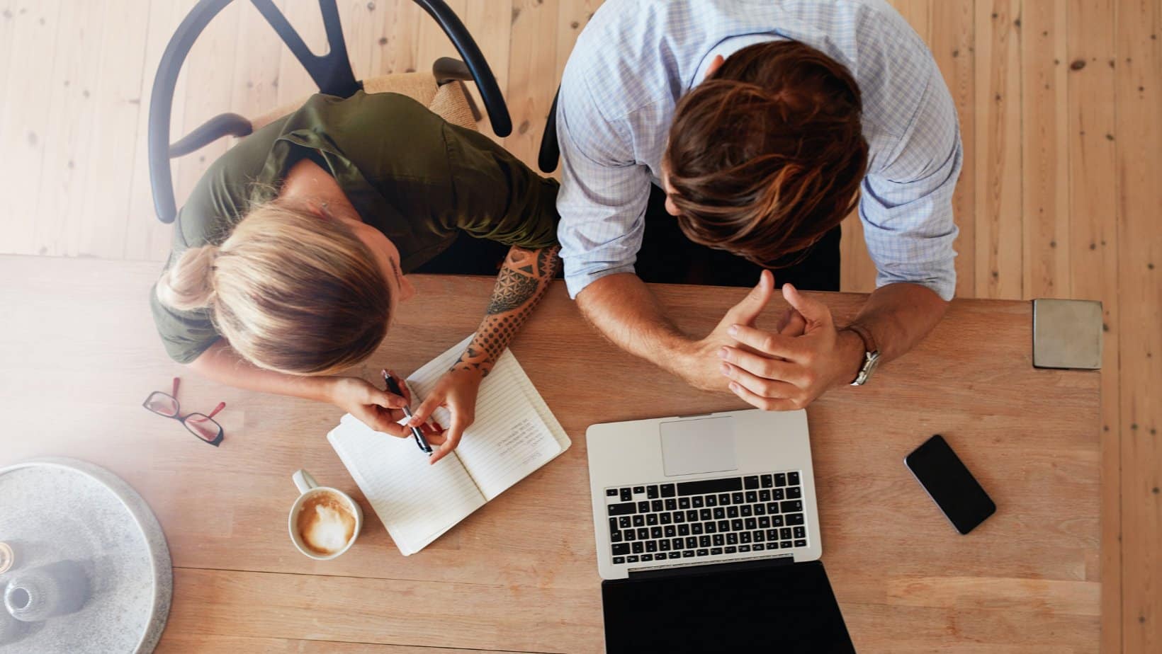 Two business partners planning a website redesign