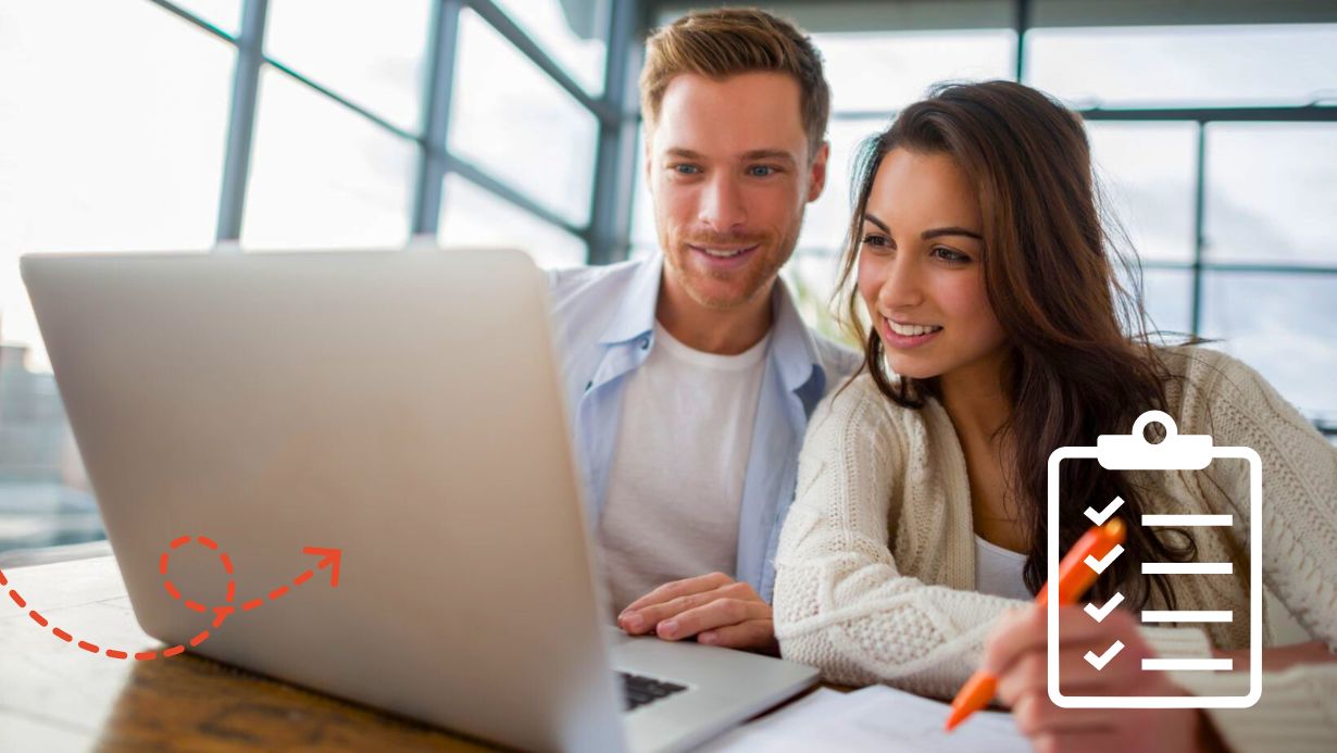 A man and woman working on a checklist on their laptop.