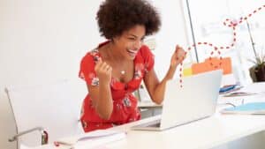 A business owner celebrates high SEO ranking